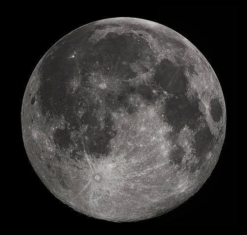 Full moon as seen from space with dark sky in background.