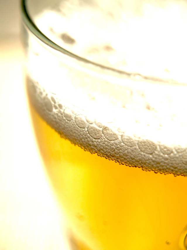 Detail of beer glass and foam.